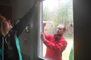 Volunteers in Buncombe Co., NC, weatherize a home.