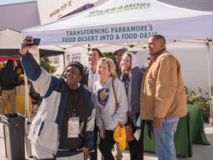 A photo of community members in Orlando, FL, working on relieving food deserts.