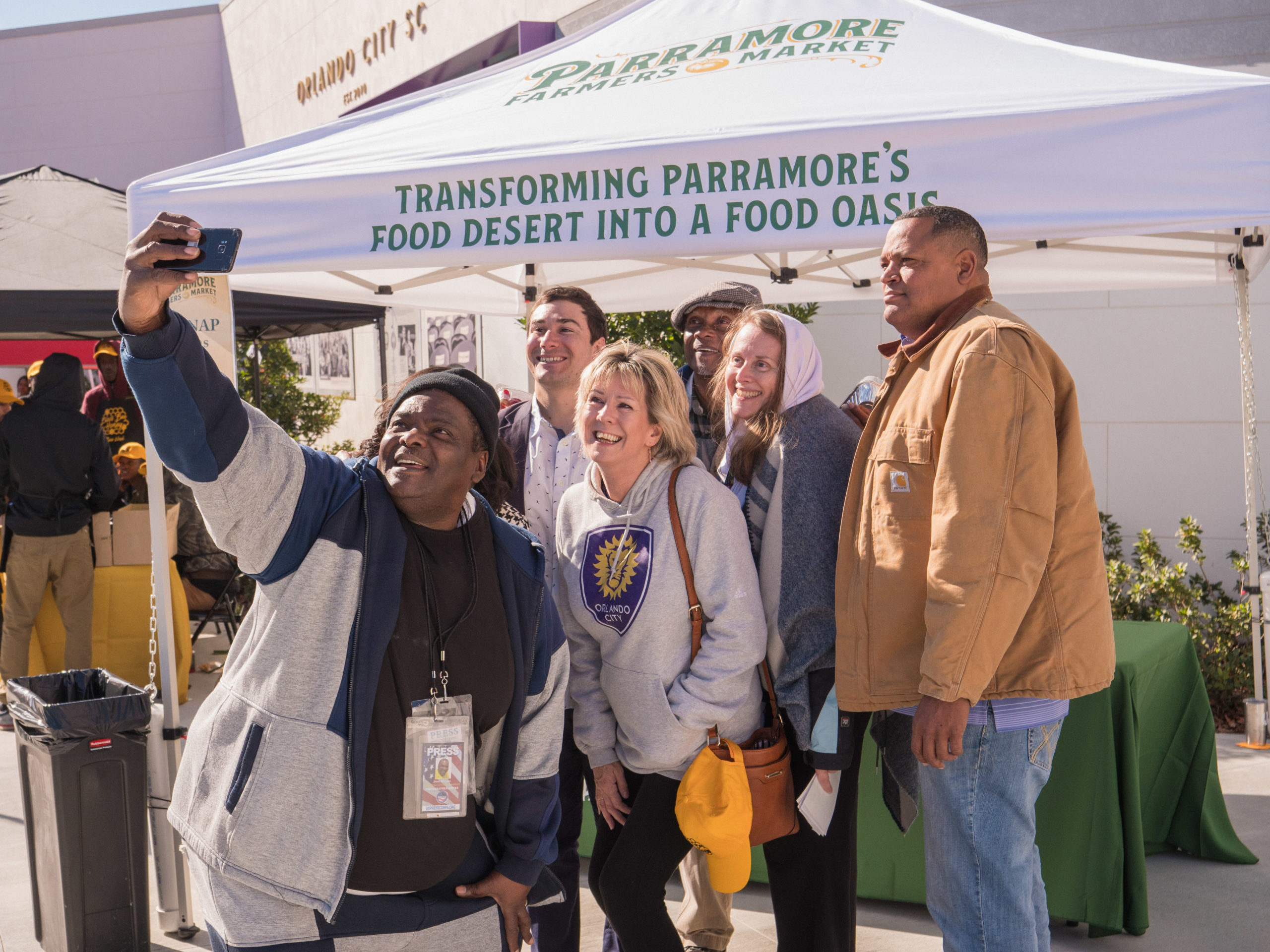 A photo of community members in Orlando, FL, working on relieving food deserts.