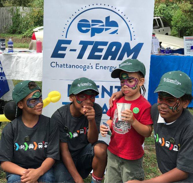 Four kids take a break after participating in community buildling exercises in Tennesse.