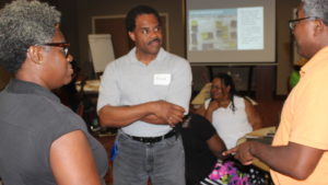 Group meeting of three residents of Duck Hill, MS.