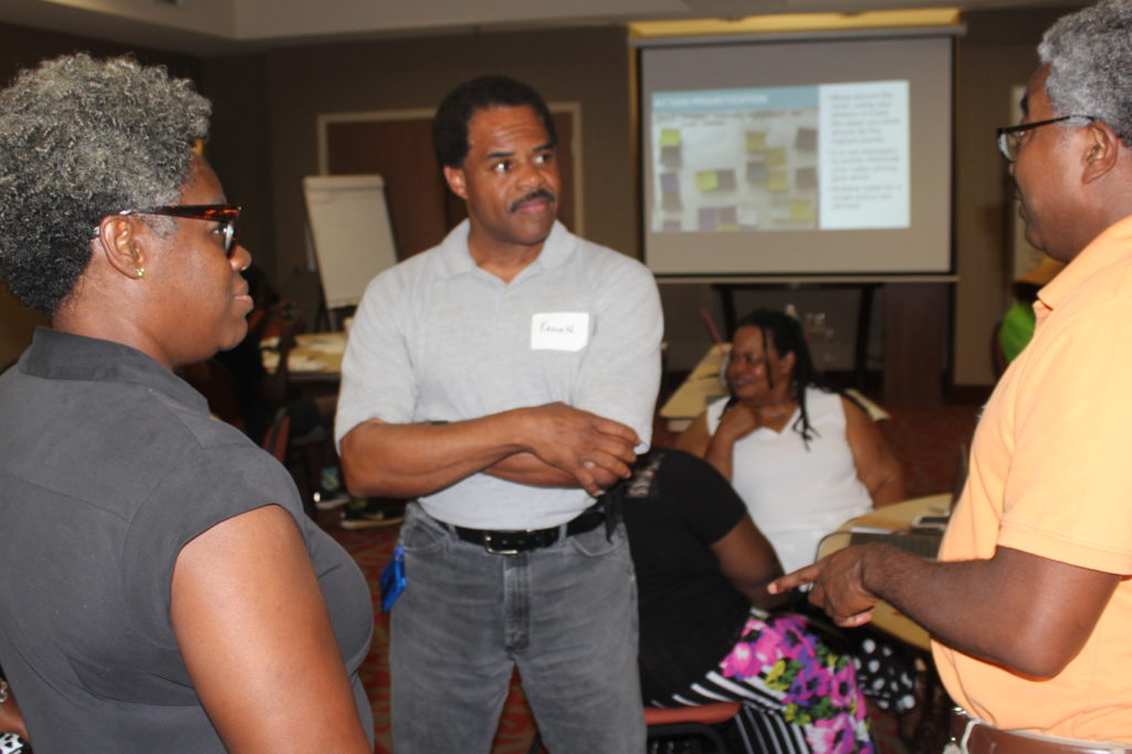 Group meeting of three residents of Duck Hill, MS.