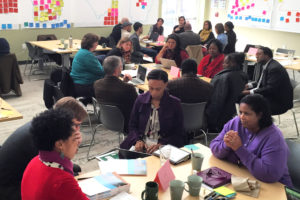 A group of community members work on sustainability solutions in the South.