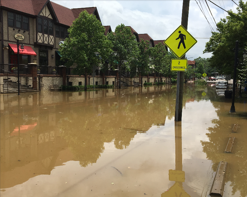 A photo of severe flooding in the Biltmore Village area of Asheville, North Carolina.