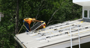 A worker installs energy efficient products in the Tennessee Valley