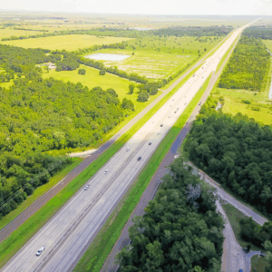 Interstate 10 running through a green landscape