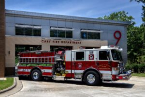 fire truck in front of a fire station