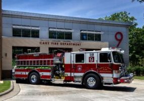 fire truck in front of a fire station