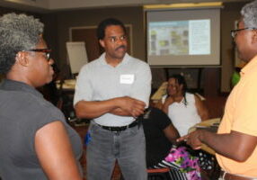 Group meeting of three residents of Duck Hill, MS.