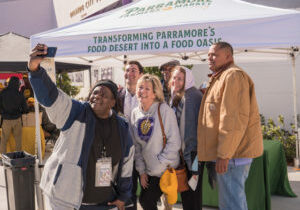 A photo of community members in Orlando, FL, working on relieving food deserts.