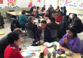 A group of community members work on sustainability solutions in the South.