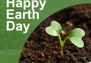 happy earth day plant in background