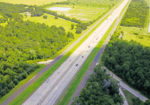 Interstate 10 running through a green landscape