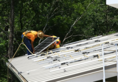 A worker installs energy efficient products in the Tennessee Valley